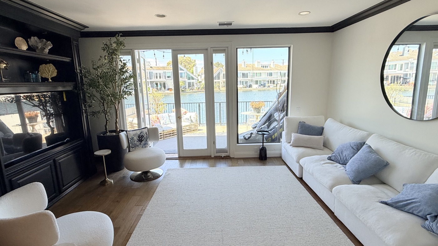 Bright coastal living room with harbour views